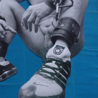 pierced male with sneakers in restraints