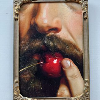 A man bites a cherry