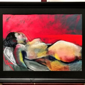 A female model reclining against a red background, rendered in soft pastels with warm and vibrant tones on primed cotton paper, framed in black wood (50x70 cm).