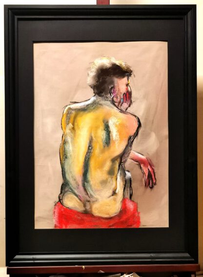 A male model seated with his back turned, rendered in soft pastels with warm yellows, pinks, and red accents, conveying a sense of fading love, framed in black wood (50x70 cm).